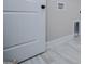 Laundry room with white door and tiled floor at 3264 Greenhill Ct, Villa Rica, GA 30180