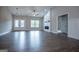 Bright living room featuring a ceiling fan, fireplace, shiplap accent wall, and glass panel french doors at 3264 Greenhill Ct, Villa Rica, GA 30180