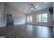 Open-concept living room featuring hardwood floors, double doors, and ample natural light from a large window at 3264 Greenhill Ct, Villa Rica, GA 30180