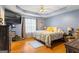 This main bedroom features a ceiling fan, trey ceiling and lots of natural light at 10 Allen Oaks Way, Covington, GA 30016