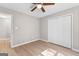 Spacious bedroom featuring wood-look floors and a ceiling fan at 135 Weeping Willow Way, Tyrone, GA 30290