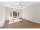 Bedroom featuring wood-look floors, and a large window providing lots of natural light at 135 Weeping Willow Way, Tyrone, GA 30290