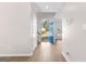 Bright foyer featuring wood-look flooring, fresh paint, and clear sightlines to the outdoors through the front door at 135 Weeping Willow Way, Tyrone, GA 30290