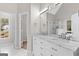 Bright main bathroom with marble countertop, double vanity, and glass shower at 135 Weeping Willow Way, Tyrone, GA 30290