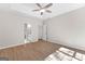 Spacious main bedroom with wood-look floors and ensuite bath access at 135 Weeping Willow Way, Tyrone, GA 30290