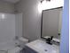 Bright bathroom featuring a shower-tub combo with white tile and a single sink vanity at 2401 Northlake Ct, Atlanta, GA 30345