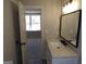 Upgraded bathroom with modern vanity, hardware and luxury vinyl tile at 2401 Northlake Ct, Atlanta, GA 30345