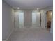 Large bedroom with neutral paint, carpet flooring, and multiple closets for ample storage at 2401 Northlake Ct, Atlanta, GA 30345