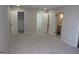 Spacious bedroom with neutral colors, plush carpeting, and access to closets and en suite bathroom at 2401 Northlake Ct, Atlanta, GA 30345