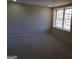 Bright, carpeted bedroom featuring a large window with view of trees at 2401 Northlake Ct, Atlanta, GA 30345