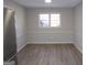 Bright dining room featuring wood floors, window, and a neutral paint scheme at 2401 Northlake Ct, Atlanta, GA 30345