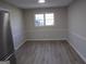 Bright dining room featuring wood floors, window, and a neutral paint scheme at 2401 Northlake Ct, Atlanta, GA 30345