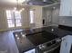 Modern kitchen featuring granite countertops and stainless steel appliances including glass cooktop at 2401 Northlake Ct, Atlanta, GA 30345