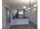 Open kitchen view with dark countertops, sleek stainless steel appliances, and modern lighting fixtures at 2401 Northlake Ct, Atlanta, GA 30345