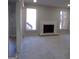 Carpeted living room featuring a white brick fireplace and natural light from two windows at 2401 Northlake Ct, Atlanta, GA 30345