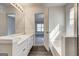 Bright bathroom with double vanity, soaking tub and wood look flooring at 2561 Rainover Ct, Decatur, GA 30034