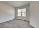 Bedroom featuring a window with blinds and neutral carpet at 2561 Rainover Ct, Decatur, GA 30034