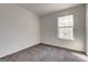 Cozy bedroom featuring neutral decor, and a window to let in natural light at 2561 Rainover Ct, Decatur, GA 30034