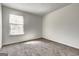 Bright bedroom featuring a window with blinds and neutral carpet at 2561 Rainover Ct, Decatur, GA 30034