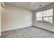 Neutral bedroom with a large window providing natural light and plush carpeting at 2561 Rainover Ct, Decatur, GA 30034