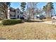 Beautiful two-story home with a spacious front yard and mature trees, offering a serene and private setting at 2561 Rainover Ct, Decatur, GA 30034