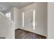 Bright foyer with wood-look flooring and front door with sidelights, offering a welcoming entrance at 2561 Rainover Ct, Decatur, GA 30034