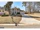 Inviting two-story home with a well-maintained lawn and a long driveway leading to an attached two-car garage at 2561 Rainover Ct, Decatur, GA 30034