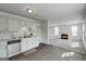 Open kitchen with stainless steel appliances flows into a living room with a fireplace at 2561 Rainover Ct, Decatur, GA 30034