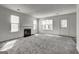 Open-concept living room featuring a fireplace and plenty of natural light from the windows at 2561 Rainover Ct, Decatur, GA 30034