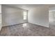 Bright living room with neutral carpet and a window for natural light at 2561 Rainover Ct, Decatur, GA 30034