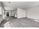 Open living area flows into a bright kitchen featuring stainless steel appliances and ample cabinet space at 2561 Rainover Ct, Decatur, GA 30034