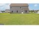 Spacious backyard featuring a lush green lawn perfect for outdoor activities and relaxation at 275 Oliver Dr, Locust Grove, GA 30248