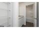 Bright bathroom features granite counters, white cabinetry, and a shower over tub at 275 Oliver Dr, Locust Grove, GA 30248