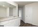 Bathroom boasting a granite countertop on white cabinetry, wood-look flooring and ample space at 275 Oliver Dr, Locust Grove, GA 30248