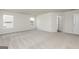 A spacious bedroom with two windows offering natural light and neutral carpet, ready for personalization at 275 Oliver Dr, Locust Grove, GA 30248