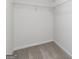 Walk-in closet featuring a carpeted floor, white trim and built-in white wire shelving at 275 Oliver Dr, Locust Grove, GA 30248