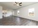 Open-concept living room with hardwood floors, neutral walls, and natural light at 275 Oliver Dr, Locust Grove, GA 30248