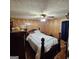 Bedroom features a bed, ceiling fan, and wood paneled walls at 4748 Ash St, Doraville, GA 30340