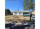 Charming single-story home featuring a cozy front porch and a well-maintained yard at 4748 Ash St, Doraville, GA 30340