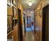 Cozy hallway features wood paneling, a patterned rug, and decorative light fixture at 4748 Ash St, Doraville, GA 30340