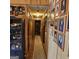 Hallway with wood-paneled walls adorned with framed photos and a decorative carpet at 4748 Ash St, Doraville, GA 30340