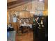Eat-in kitchen with wooden cabinets and wainscoting, showcasing a cozy dining area and appliances at 4748 Ash St, Doraville, GA 30340