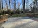 Large backyard featuring a trampoline and wooded area at 3370 Creek Hollow Dr, Marietta, GA 30062