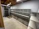 Unfinished basement area with shelving for storage at 3370 Creek Hollow Dr, Marietta, GA 30062