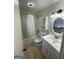 Clean bathroom with a shower-tub combo, vanity, and medicine cabinet at 3370 Creek Hollow Dr, Marietta, GA 30062