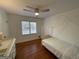 Bright bedroom with hardwood floors, a canopy bed, and natural light from the window at 3370 Creek Hollow Dr, Marietta, GA 30062