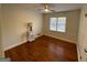 Bedroom featuring hardwood floors, a window, and a lamp on a bedside table at 3370 Creek Hollow Dr, Marietta, GA 30062