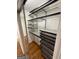 Walk-in closet with adjustable shelving and ample storage space at 3370 Creek Hollow Dr, Marietta, GA 30062