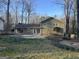 Backyard view of the home with a well-maintained lawn and patio at 3370 Creek Hollow Dr, Marietta, GA 30062