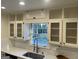 Modern kitchen with white cabinets, subway tile backsplash, stainless faucet, and window above the sink at 3370 Creek Hollow Dr, Marietta, GA 30062